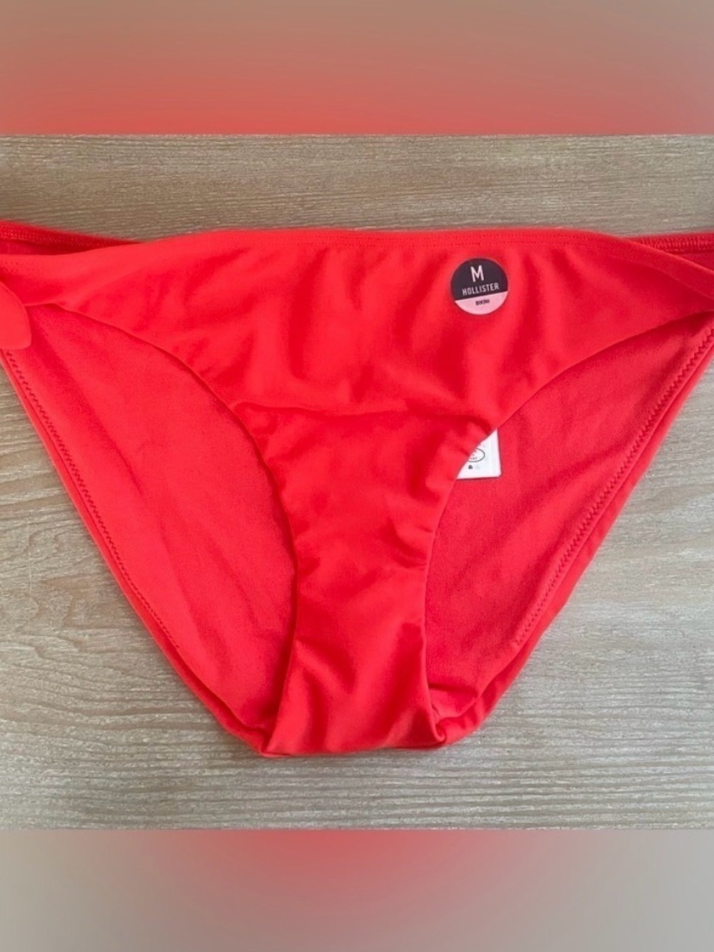 New Hollister bright cherry red cheeky bikini bottoms with side tie; size M